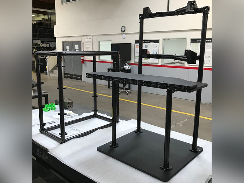 Image shows the avionics workstation on a table top in a manufacturing bay. The carbon fiber and CARBONNect™ construction is almost completed.